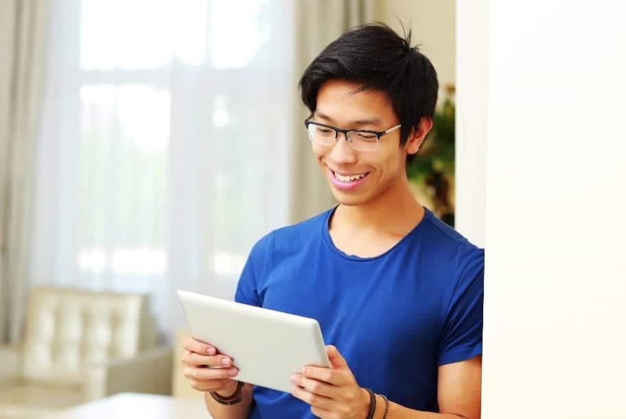 Young man looking at a tablet.