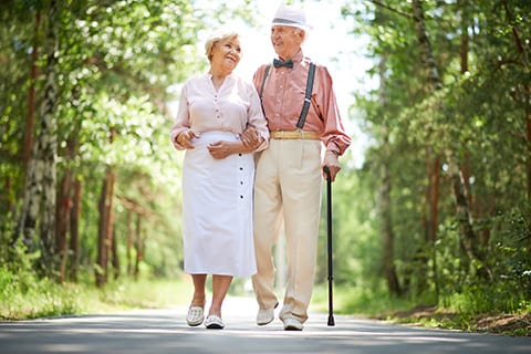 Senior couple walking in the park